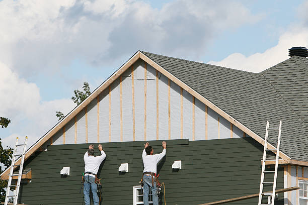 Professional Siding technician working in Enon, OH